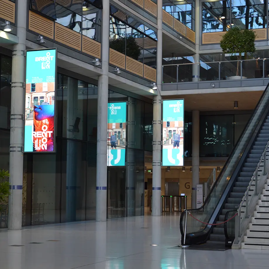 Brent Council atrium with digital video walls displaying civic messaging, part of a compliance-led AV upgrade